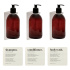 Shower Package Premium - Brushed Stainless Steel soap pump set with brown pump bottle, base soap pump holder, and labels in beige color